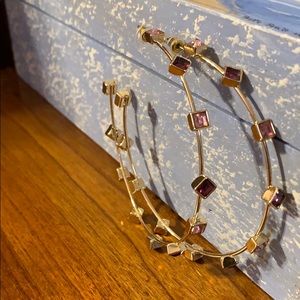 Gold toned hoop earrings with rhinestones